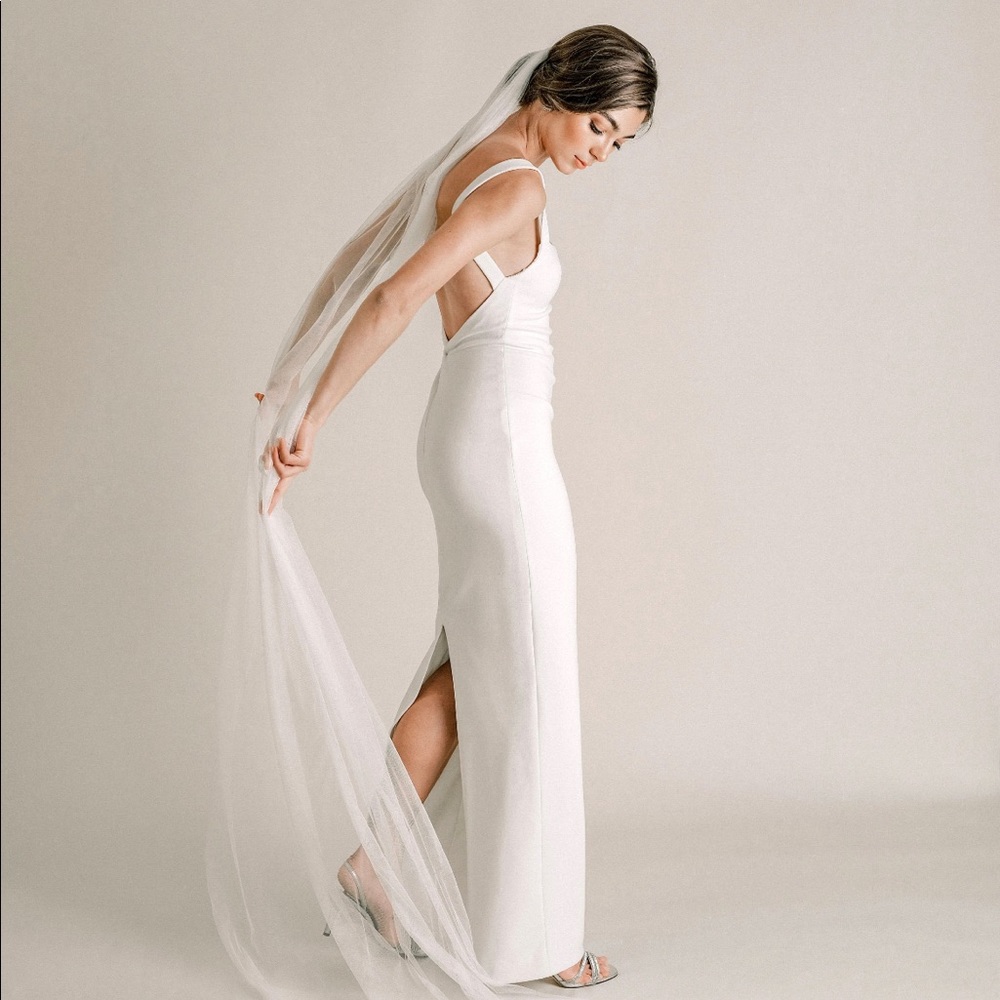 Single tier cathedral length wedding veil made of soft tulle. YuriC 120” length